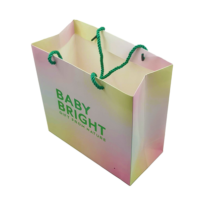 comprar 80-350gm Bolsas de papel de compras con mango para vestidos Comida con patrón de logotipo de impresión online manufacture