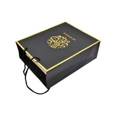Bolsos que hacen compras de papel de encargo negros durables con el logotipo de la hoja del golf